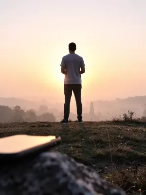 Person enjoying sunrise, symbolizing digital well-being and screen time reduction