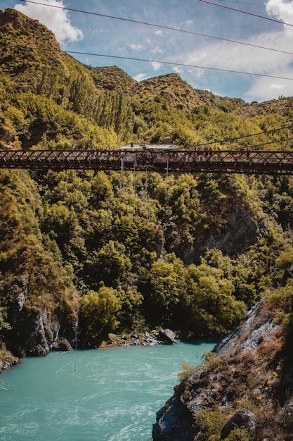 Panoramic view of Machu Picchu from the train, showcasing the iconic ruins and surrounding mountain landscape.