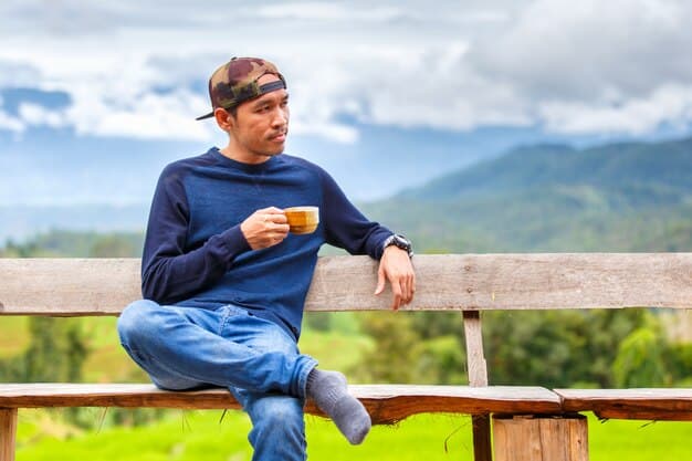 A traveler sitting on a bench in Arequipa, Peru, sipping mate de coca and looking relaxed. The background shows the city's architecture and the Misti volcano. The image illustrates a rest day during acclimatization.