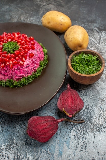 A visually appealing presentation of causa, a layered potato dish, featuring vibrant colors and textures. The causa is topped with avocado, shrimp, and a creamy sauce, showcasing the dish's elegant composition and Peruvian ingredients.