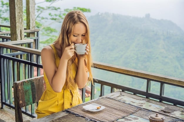 A traveler drinking coca tea in a traditional Peruvian cafe. The traveler is smiling and looks relaxed, with the Andes mountains visible in the background.