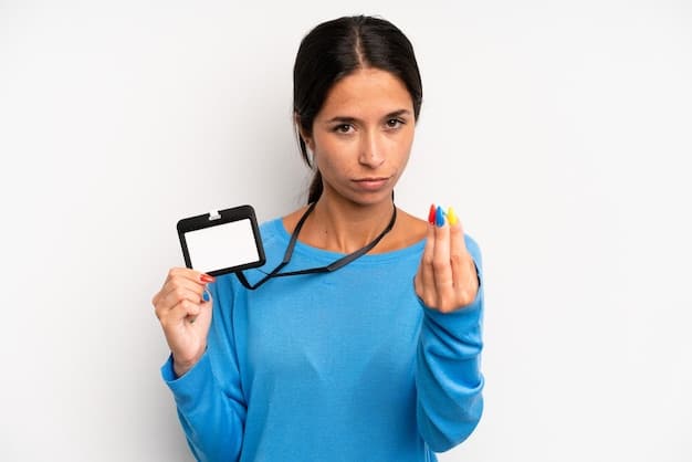A close-up shot of a Medicaid card being held by a person with Peruvian heritage, symbolizing access to affordable healthcare.