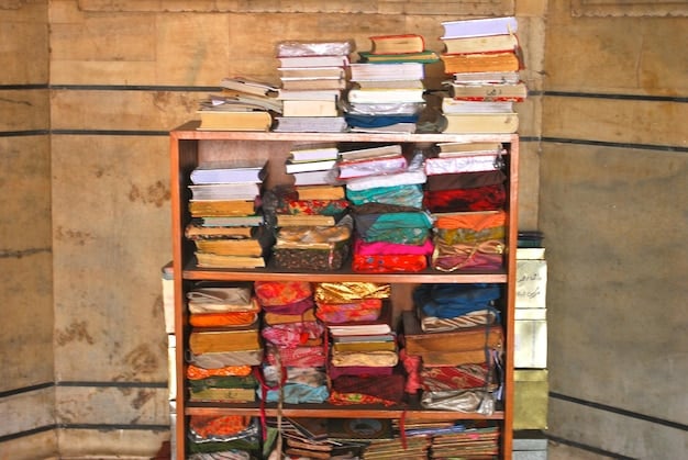 A shot of a library shelf filled with books by Peruvian authors, featuring titles in both Spanish and English. The scene is well-lit, and the books are arranged neatly, inviting exploration and discovery.