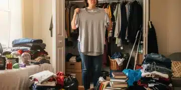 Declutter Your Home in 7 Days: 2026 Minimalist Challenge Woman organizing and decluttering a messy closet.