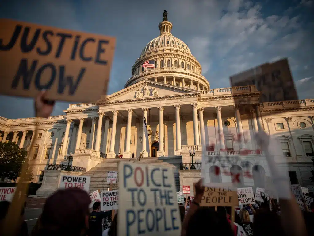 US Capitol building with protest signs overlay